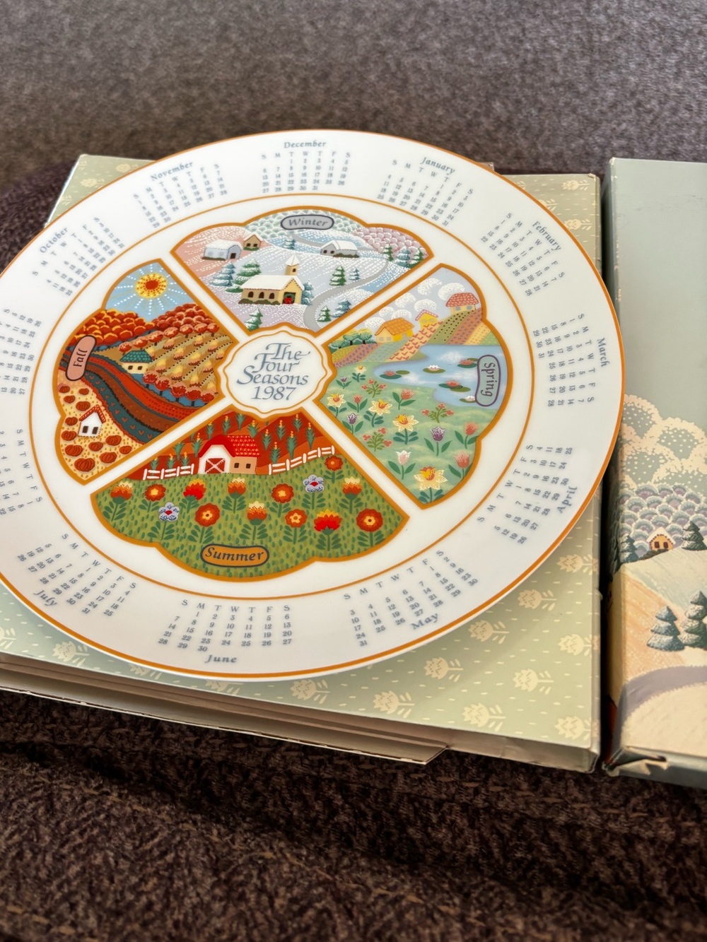 Avon Cream and Blue 'The Four Seasons' Decorative Calendar Plate